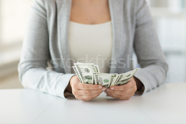 close up of woman hands counting us dollar money Stock photo © dolgachov