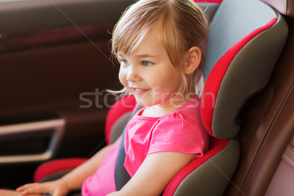 happy little girl sitting in baby car seat Stock photo © dolgachov