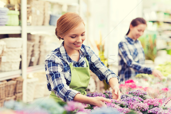 [[stock_photo]]: Heureux · femme · soins · fleurs · effet · de · serre