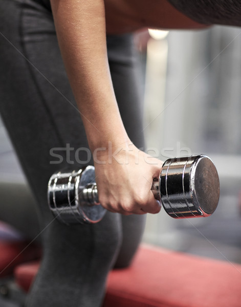 close up of couple with dumbbell exercising in gym Stock photo © dolgachov