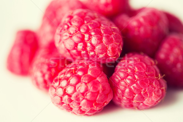 juicy fresh ripe red raspberries on white Stock photo © dolgachov