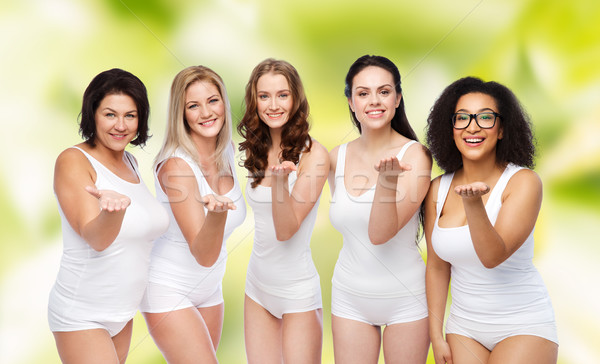 group of happy different women sending blow kiss Stock photo © dolgachov