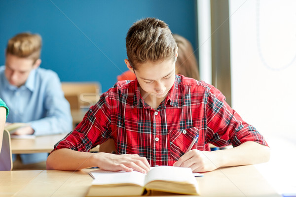 Stock photo: group of students with books writing school test