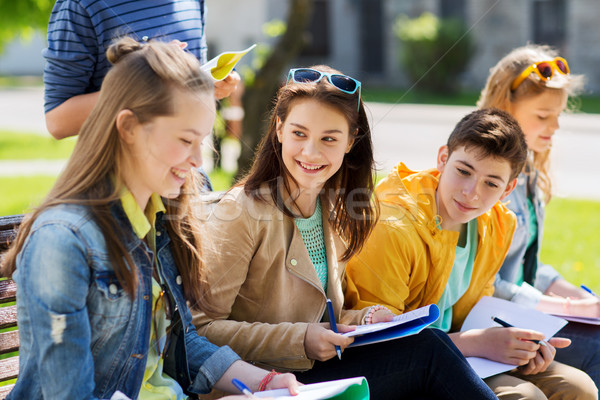 group of students with notebooks at school yard Stock photo © dolgachov