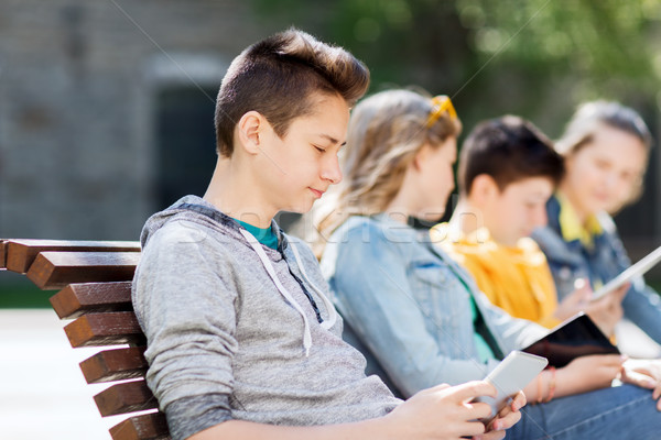 happy teenage boy with tablet pc computer outdoors Stock photo © dolgachov