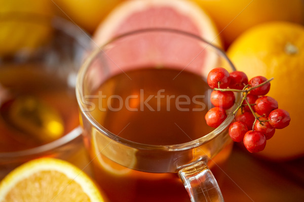 close up of tea cup with rowanberry Stock photo © dolgachov