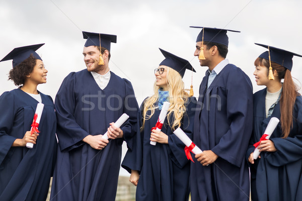 Feliz estudantes educação graduação pessoas grupo Foto stock © dolgachov
