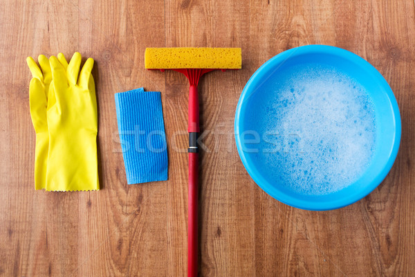 basin with cleaning stuff on wooden background Stock photo © dolgachov