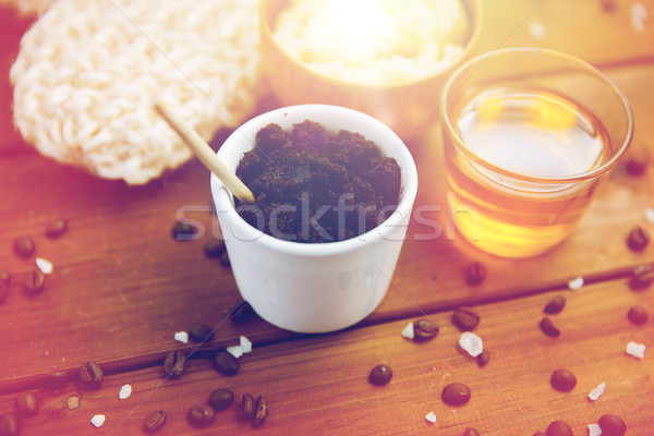 close up of coffee scrub in cup and honey on wood Stock photo © dolgachov