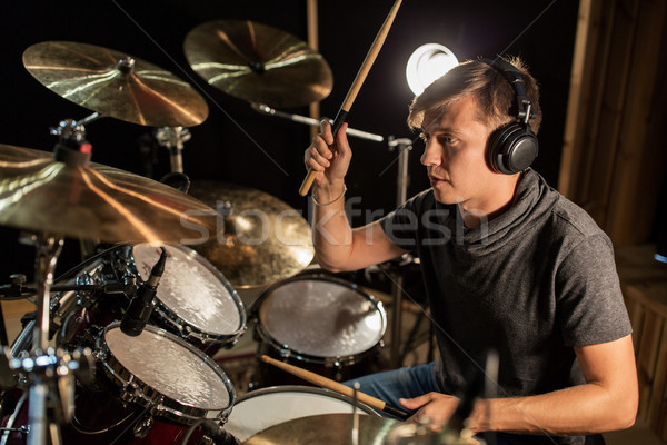 male musician playing drums and cymbals at concert Stock photo © dolgachov