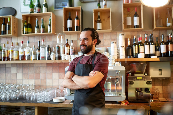 happy man, barman or waiter at bar Stock photo © dolgachov