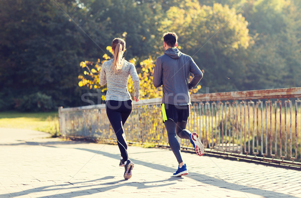 couple running or jogging outdoors Stock photo © dolgachov