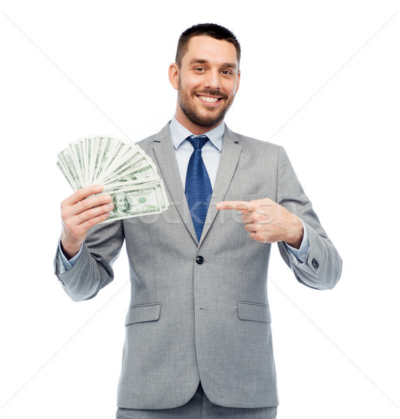 smiling businessman with american dollar money Stock photo © dolgachov