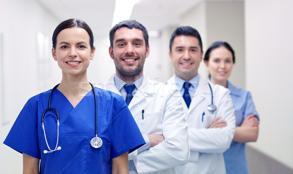 Stock photo: group of happy medics or doctors at hospital