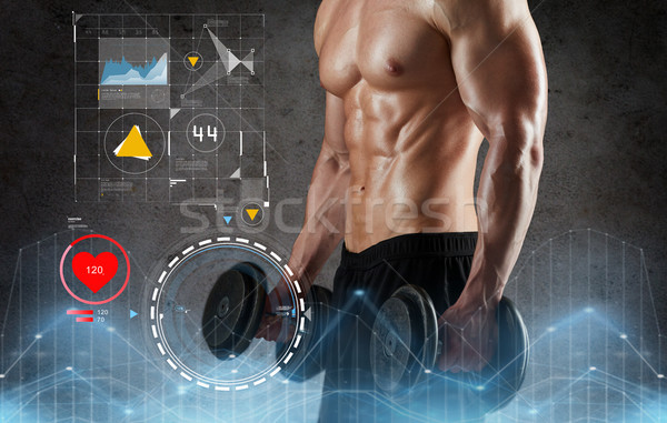 close up of man with dumbbells exercising Stock photo © dolgachov