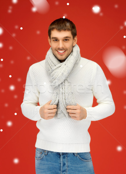 handsome man in warm sweater and scarf Stock photo © dolgachov