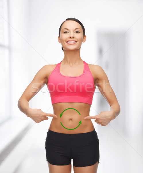 woman with arrows on her stomach Stock photo © dolgachov