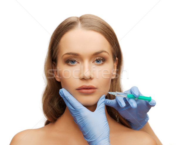 Vrouw gezicht handen spuit cosmetische chirurgie vrouw gezicht Stockfoto © dolgachov