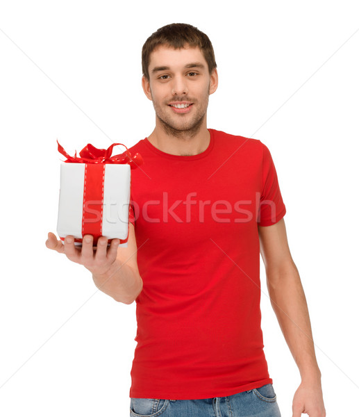 smiling man in red shirt with gift box Stock photo © dolgachov