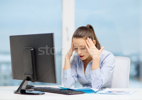 stressed woman with computer and documents Stock photo © dolgachov