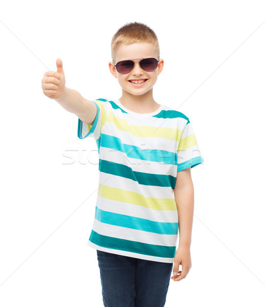 smiling little boy in sunglasses showing thumbs up Stock photo © dolgachov