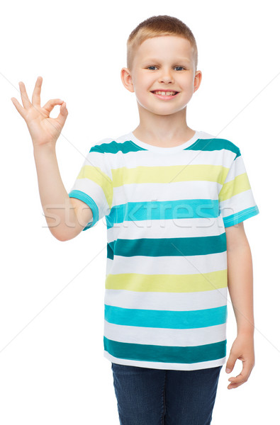 little boy in casual clothes showing OK gesture Stock photo © dolgachov