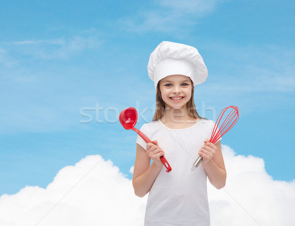 smiling girl in cook hat with ladle and whisk Stock photo © dolgachov