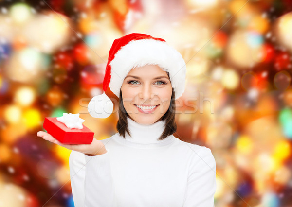 smiling woman in santa helper hat with gift box Stock photo © dolgachov