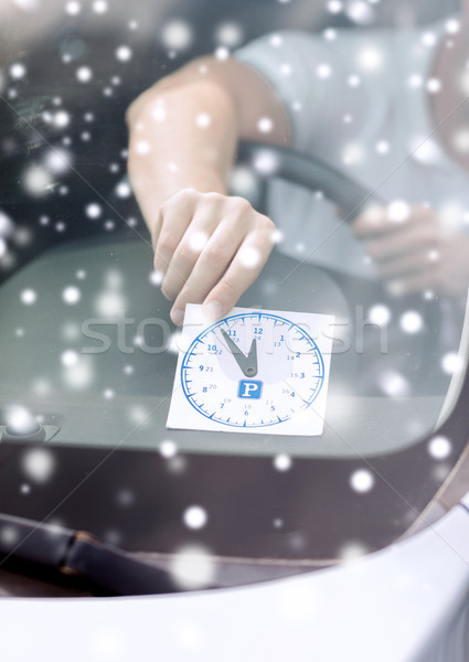 close up of man putting parking clock Stock photo © dolgachov