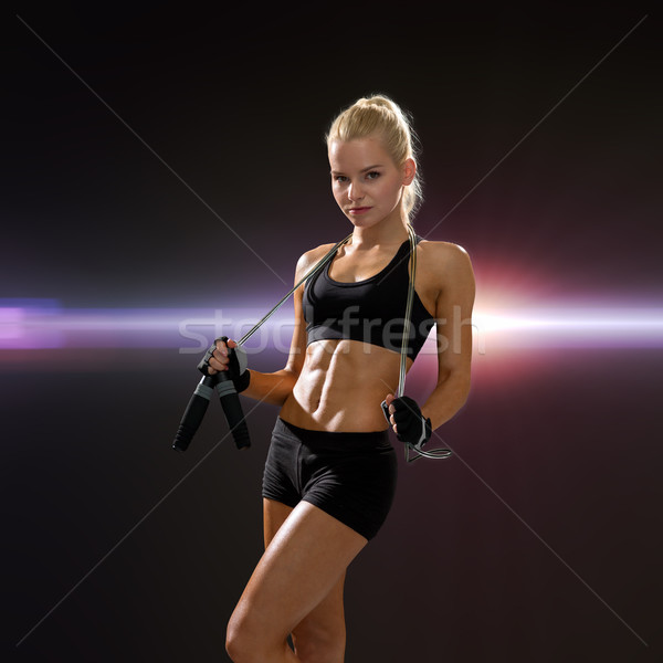 sporty woman with skipping rope Stock photo © dolgachov