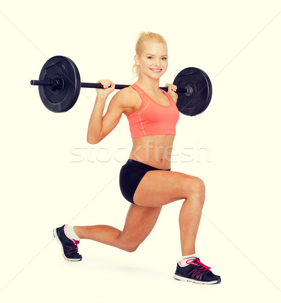 Souriant femme barbell fitness [[stock_photo]] © dolgachov