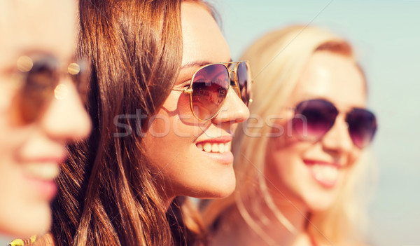 close up of smiling young women in sunglasses Stock photo © dolgachov