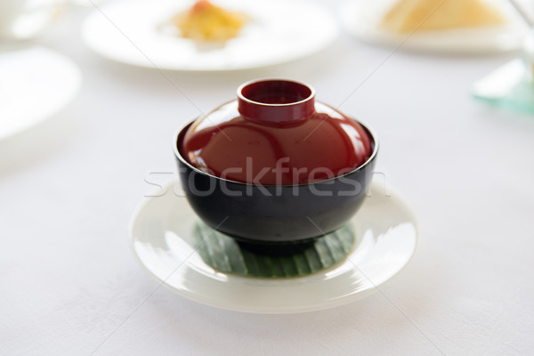 ceramic pot with hot dish on restaurant table Stock photo © dolgachov