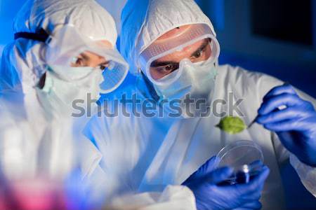 close up of scientists with test samples in lab Stock photo © dolgachov