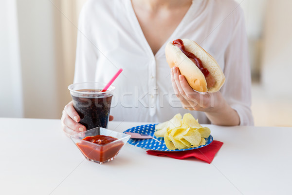 close up of woman eating hot dog with coca cola Stock photo © dolgachov