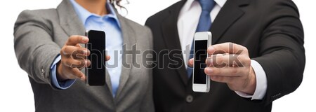 Stock fotó: üzletember · üzletasszony · okostelefonok · üzlet · technológia · fekete