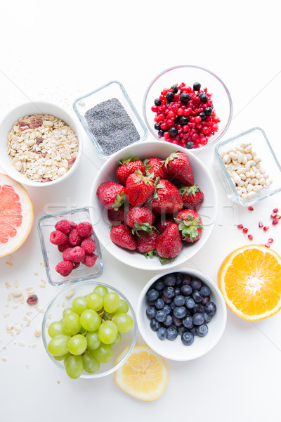 close up of fruits and berries in bowl on table Stock photo © dolgachov