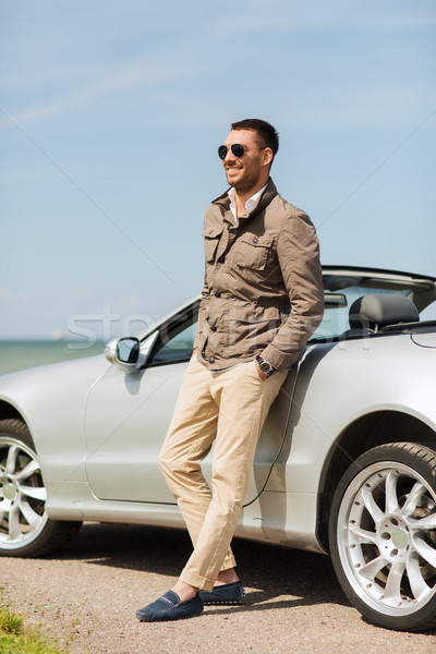 happy man near cabriolet car outdoors Stock photo © dolgachov