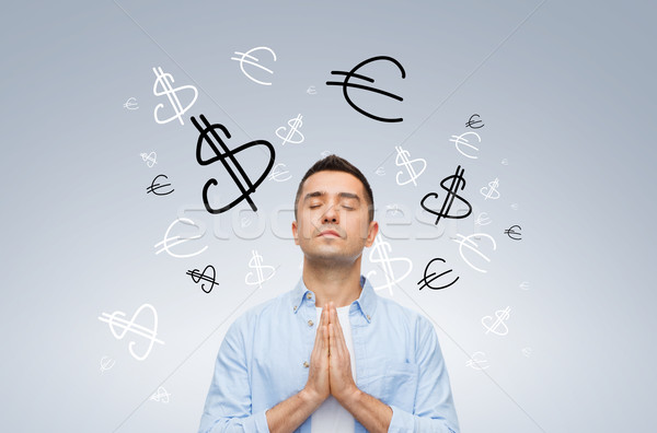 happy man praying god for money Stock photo © dolgachov