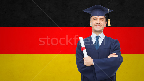 Sonriendo adulto estudiante diploma educación graduación Foto stock © dolgachov