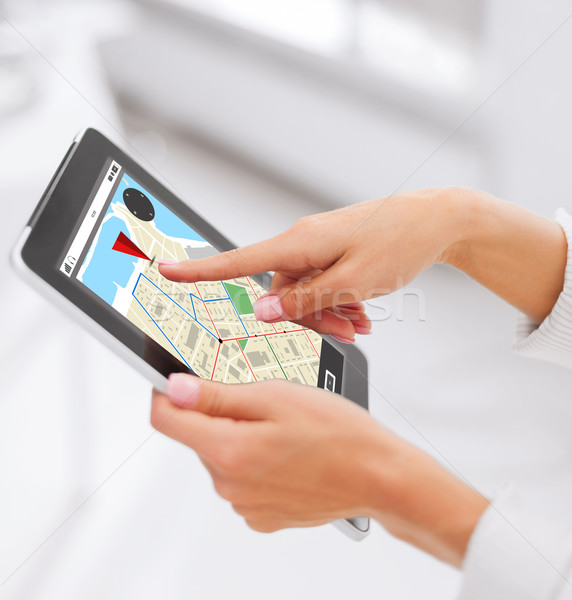 close up of hands with navigator map on tablet pc Stock photo © dolgachov