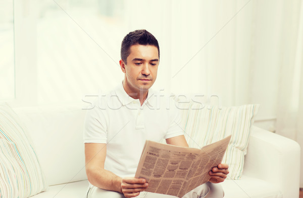 man reading newspaper at home Stock photo © dolgachov