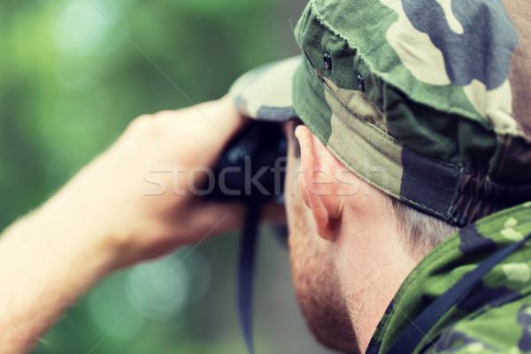 close up of soldier or hunter with binocular Stock photo © dolgachov