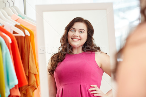 happy plus size woman posing at home mirror Stock photo © dolgachov
