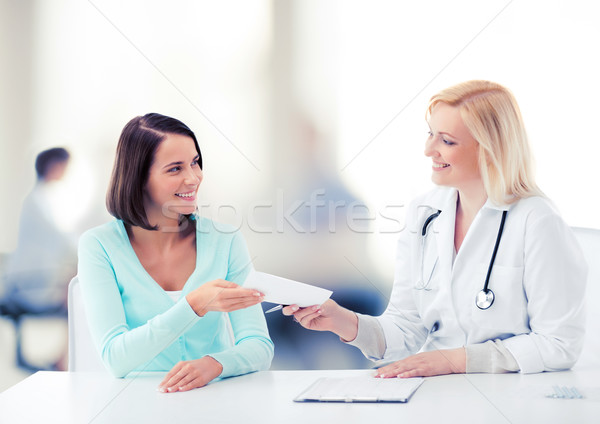 doctor giving prescription to patient in hospital Stock photo © dolgachov