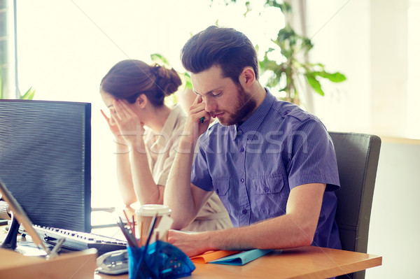 business team with computer and files in office Stock photo © dolgachov