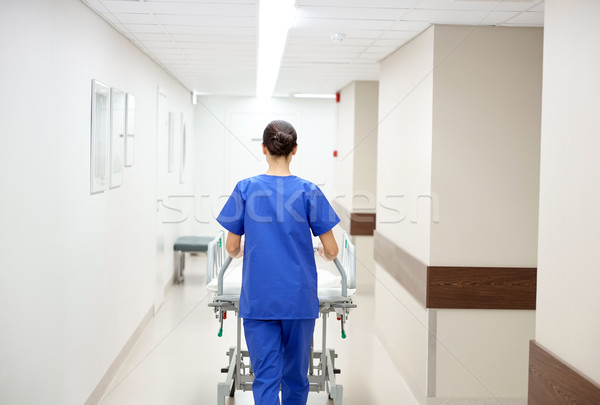 nurse carrying hospital gurney to emergency room Stock photo © dolgachov