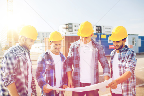 group of builders with tablet pc and blueprint Stock photo © dolgachov