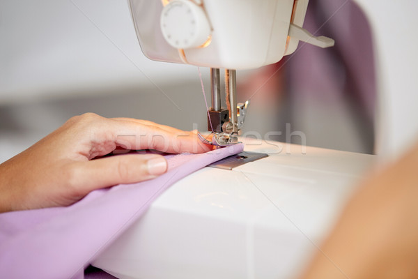 sewing machine presser foot stitching fabric Stock photo © dolgachov