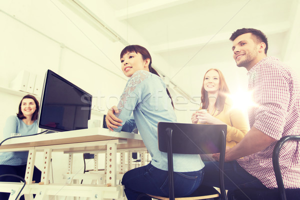 happy creative team drinking coffee at office Stock photo © dolgachov